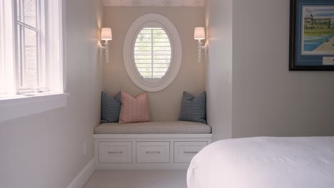 cozy window bench with colorful pillows in bedroom