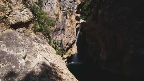 waterfall and stream with showy turquoise waters