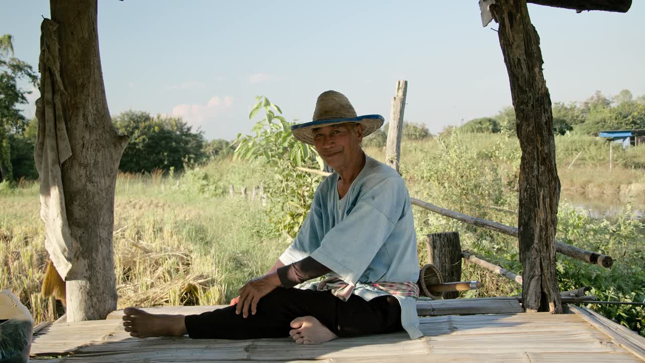 Smiling Farmer in a Rice Paddy