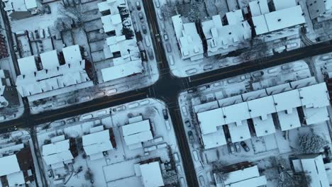 Aerial-establishing-shot-of-traffic-on-a-slushy-winter-junction