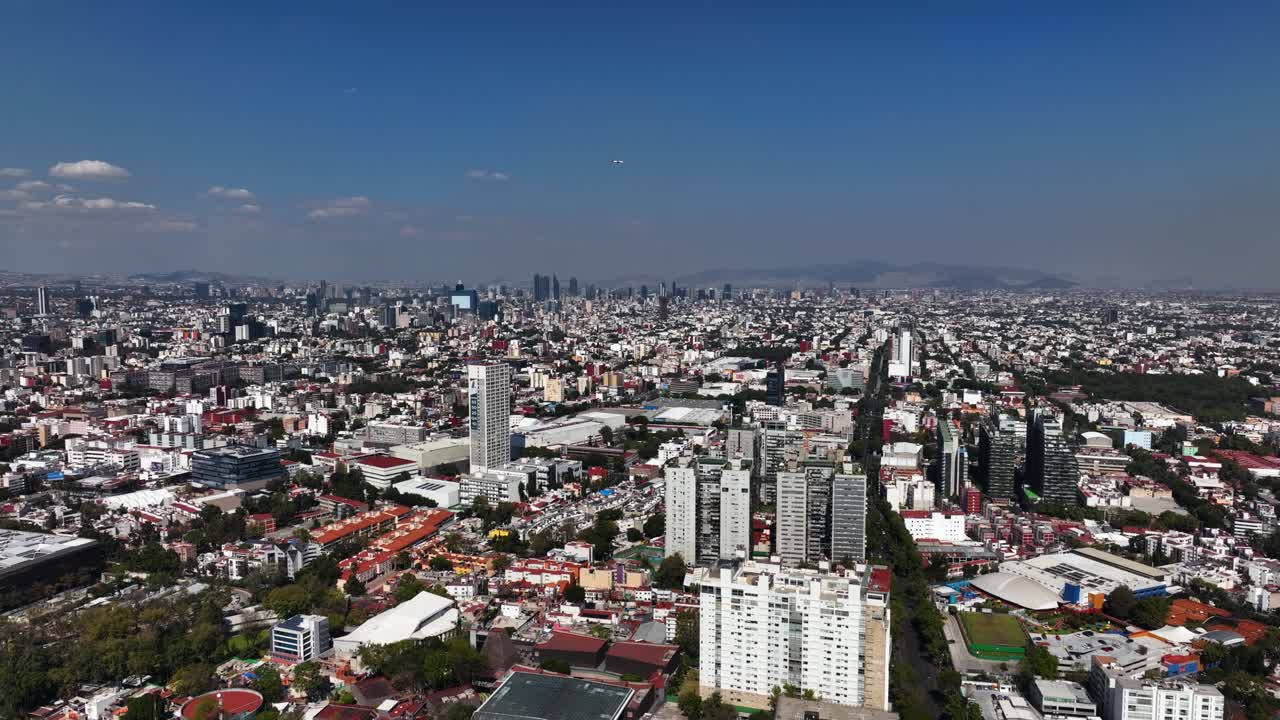 Aerial view overlooking the Benito Juarez borough cityscape, in sunny Mexico city