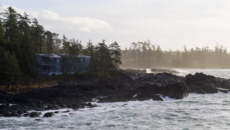 Drone-video-at-sunset-in-Ucluelet-British-Columbia,-Canada-over-the-ocean-and-forest