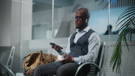 businessman waiting at airport lounge