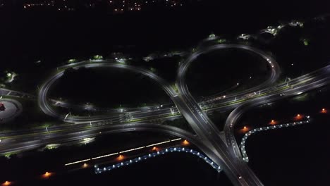 Drone-shop-over-a-heart-shaped-bridge-in-Taiwan-with-train-passing-through