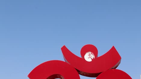 holy-om-sign-board-with-bright-blue-sky-at-morning-from-flat-angle-video-is-taken-at-ratanada-jodhpur-rajasthan-india-on-Nov-14-2022