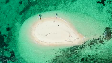 sand island in the ocean looking down drone shot - naked island philippines