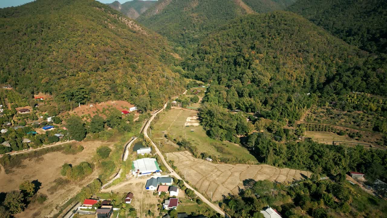 Aerial Scenic Drone Footage of the Countryside and Mountains of Pai, Thailand on a Sunny Day