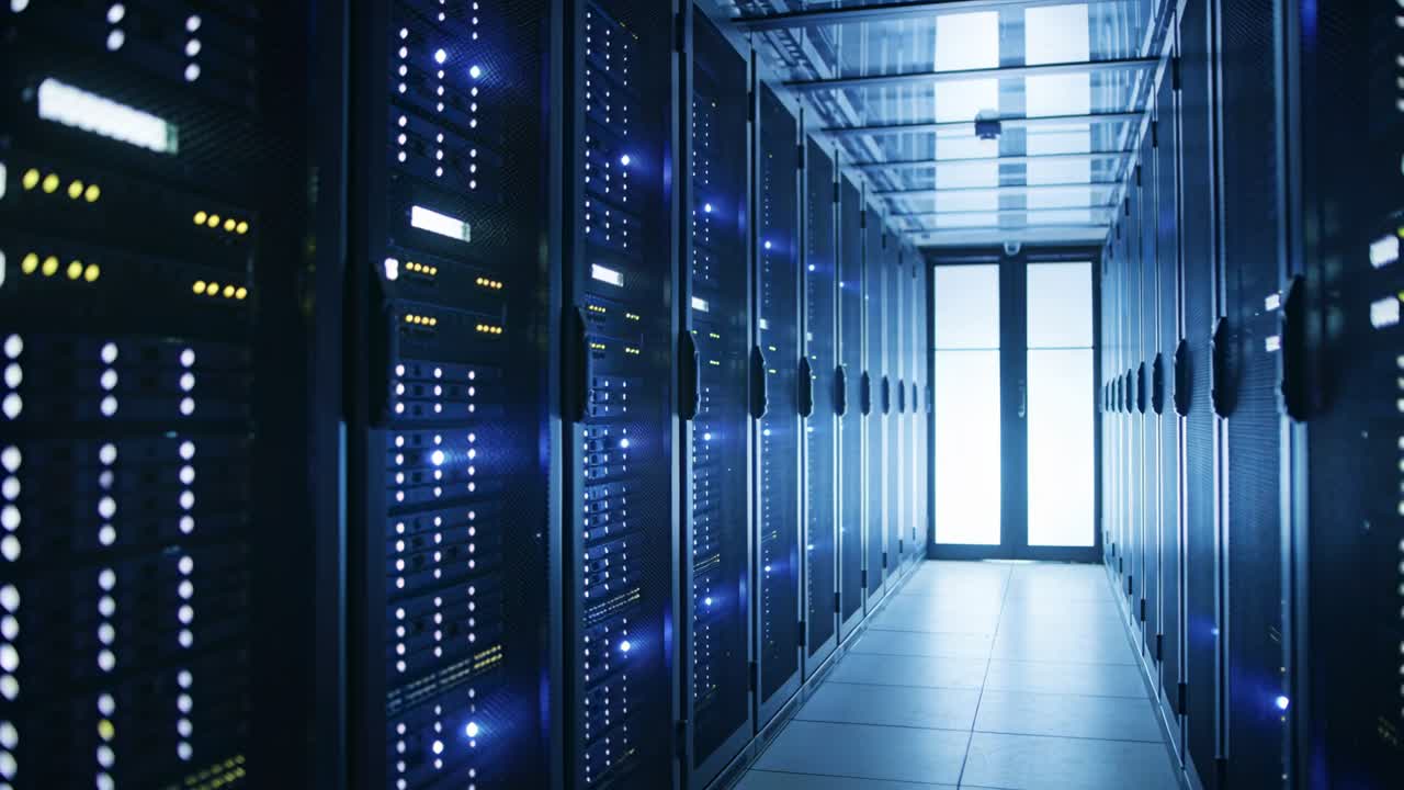 Gliding camera showing central server rack aisle moving forward in data center, with blinking LEDs