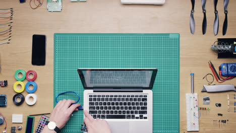 top view software engineer hands coding  at desk from above - red epic dragon