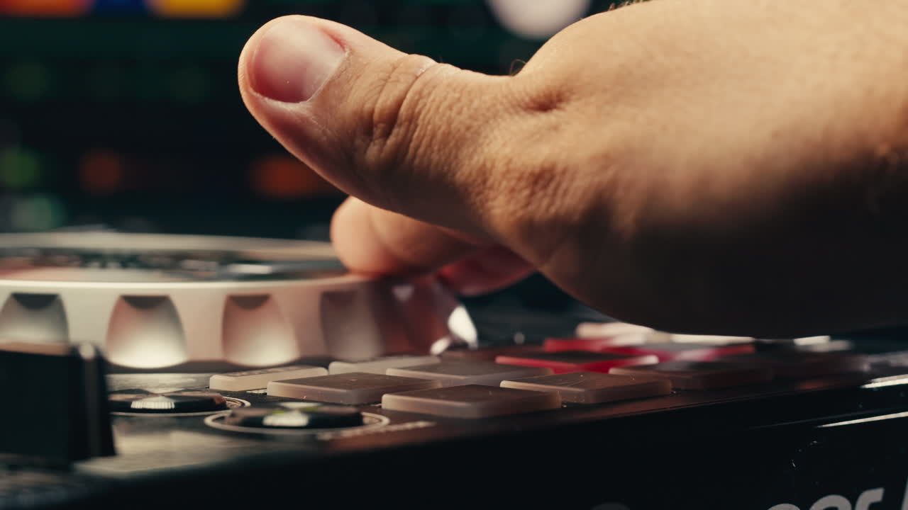 DJ with headphones and sunglasses playing music on festival in night club. Techno musician performing at nightclub for concert crowd of people, city bar.