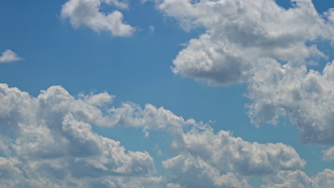 Clouds forming in the sky during midday with bright sunlight
