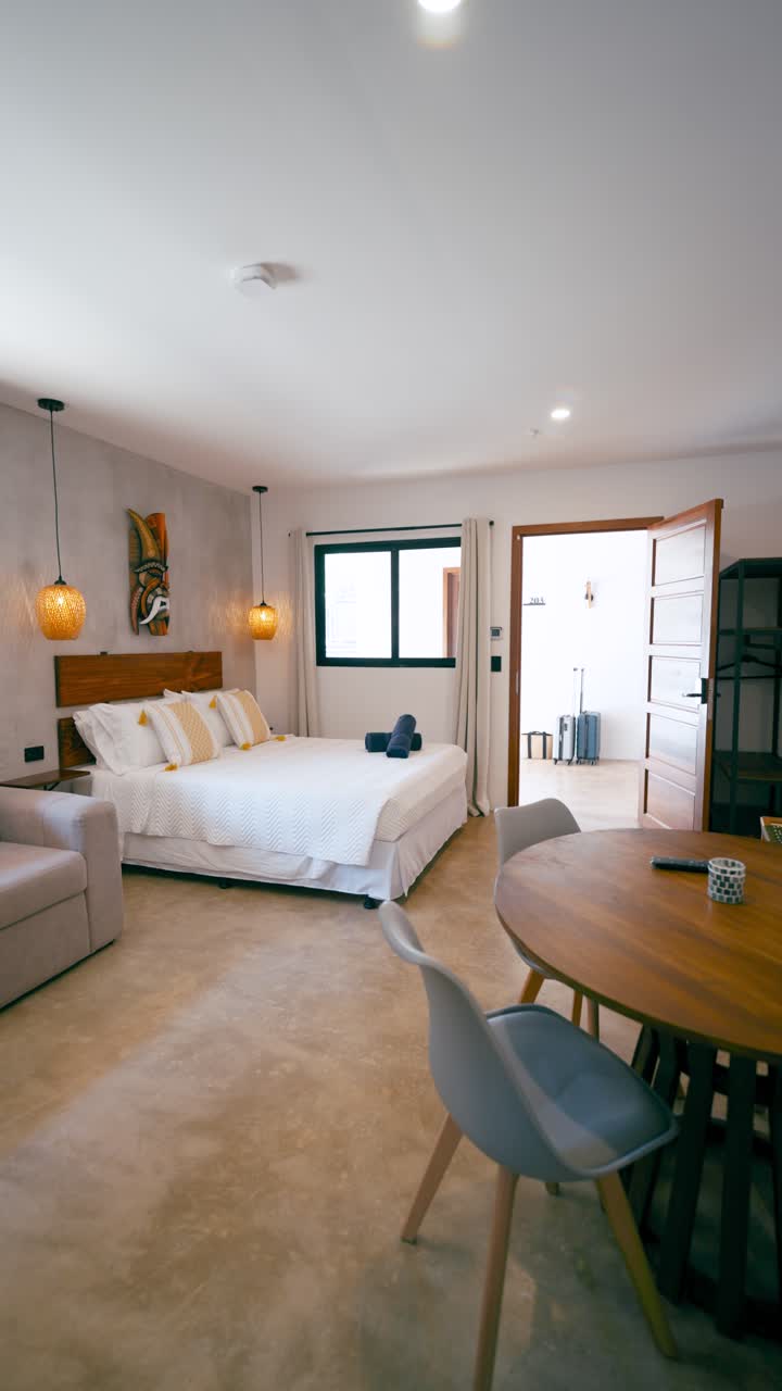 Modern Studio Apartment with Bed and Dining Table