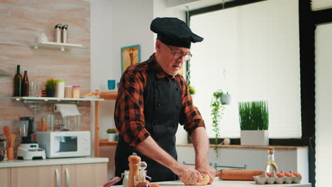 confectioner working at home with the raw dough