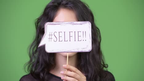 young beautiful woman with paper sign
