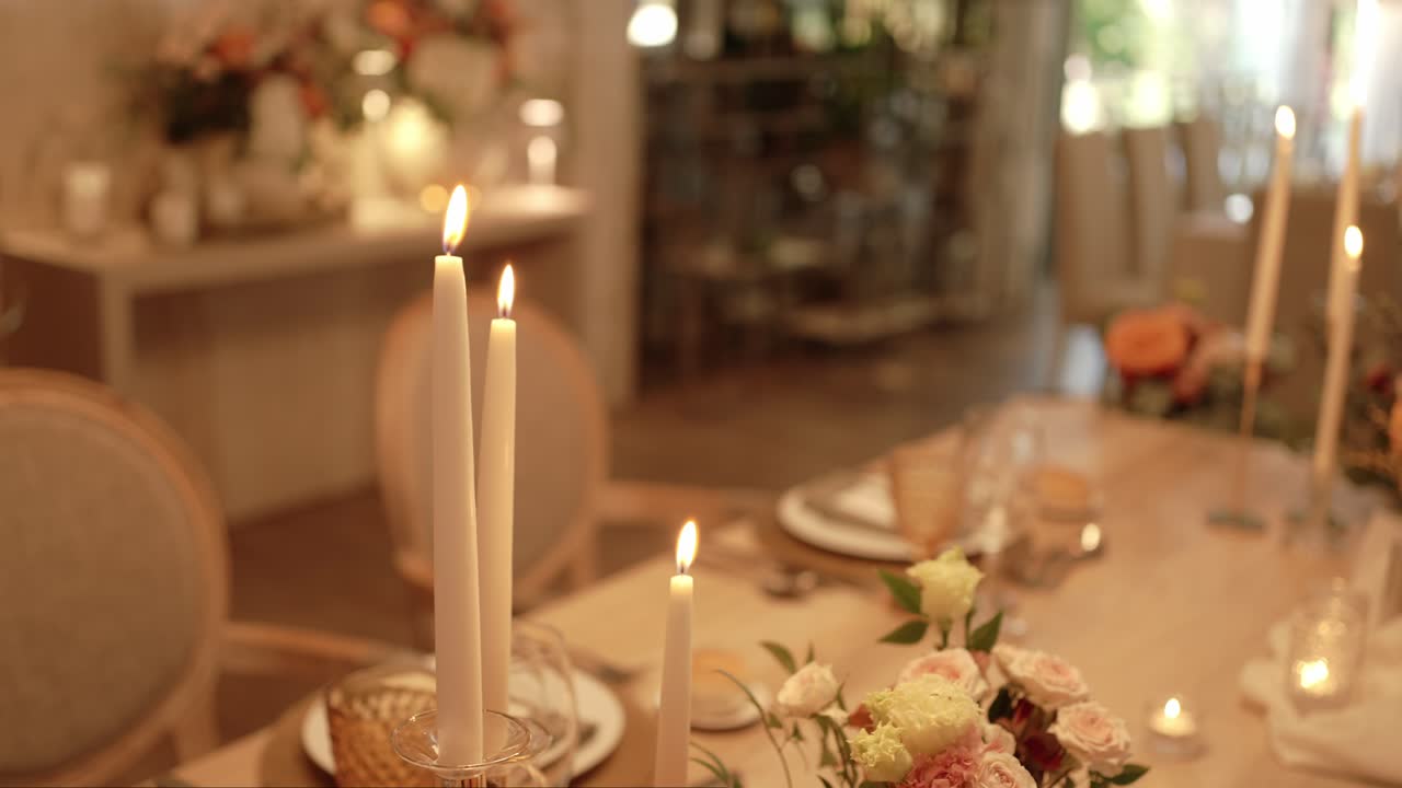 elegant wedding table decor with lit candles and soft flowers