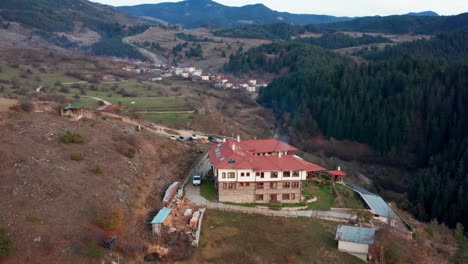 aerial view of building in rhodope mountains standing on a cliff