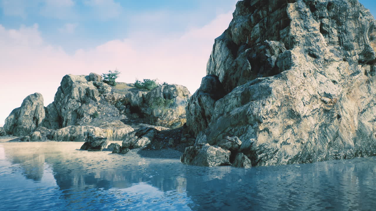 Coastal serenity with majestic rocks and gentle waters at sunset