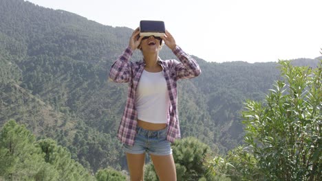 beautiful woman in vr glasses on nature