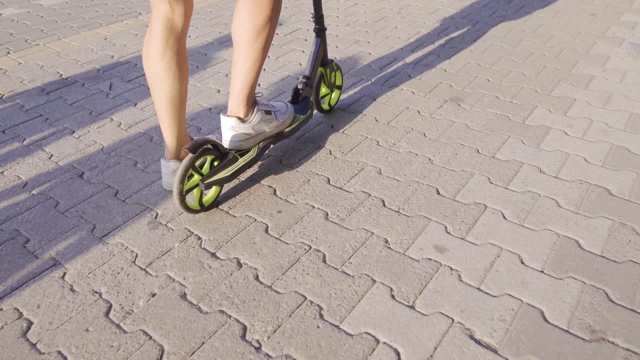 Riding the scooter.