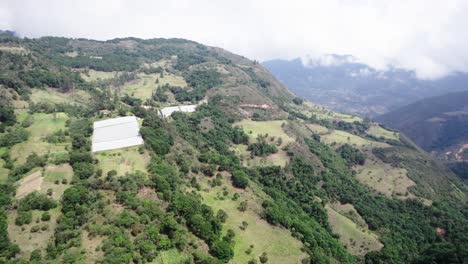 Moving-aerial-view-of-green-hills-with-mountain-plants-on-them