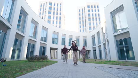 young women dancing modern choreography in urban setting