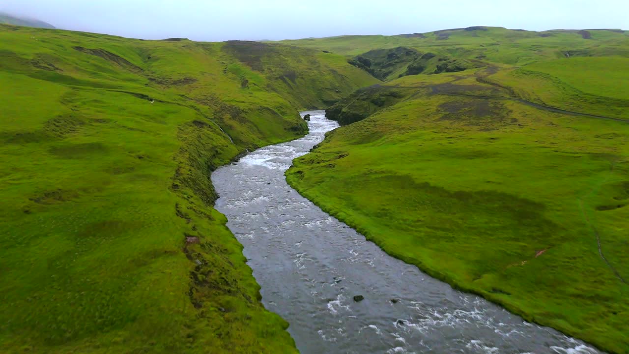 The aerial views of Skógafoss reveal the dramatic cliffs and rugged landscape, offering a unique insight into the breathtaking scenery of Iceland.