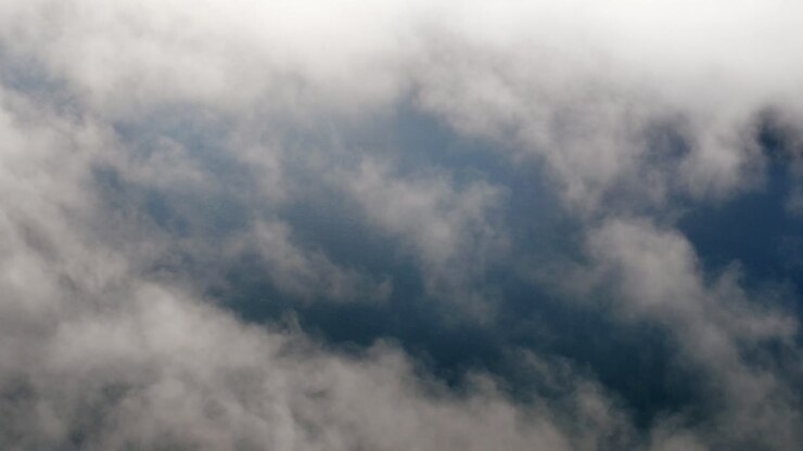 Aerial shot over the clouds in the Tziscao Lake, Montebello National Park, Chiapas