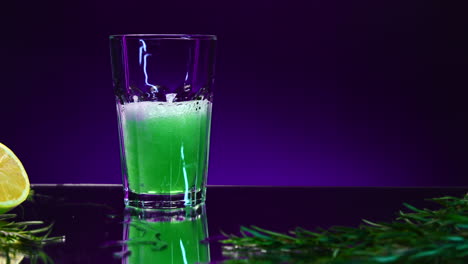 pouring a refreshing green cocktail