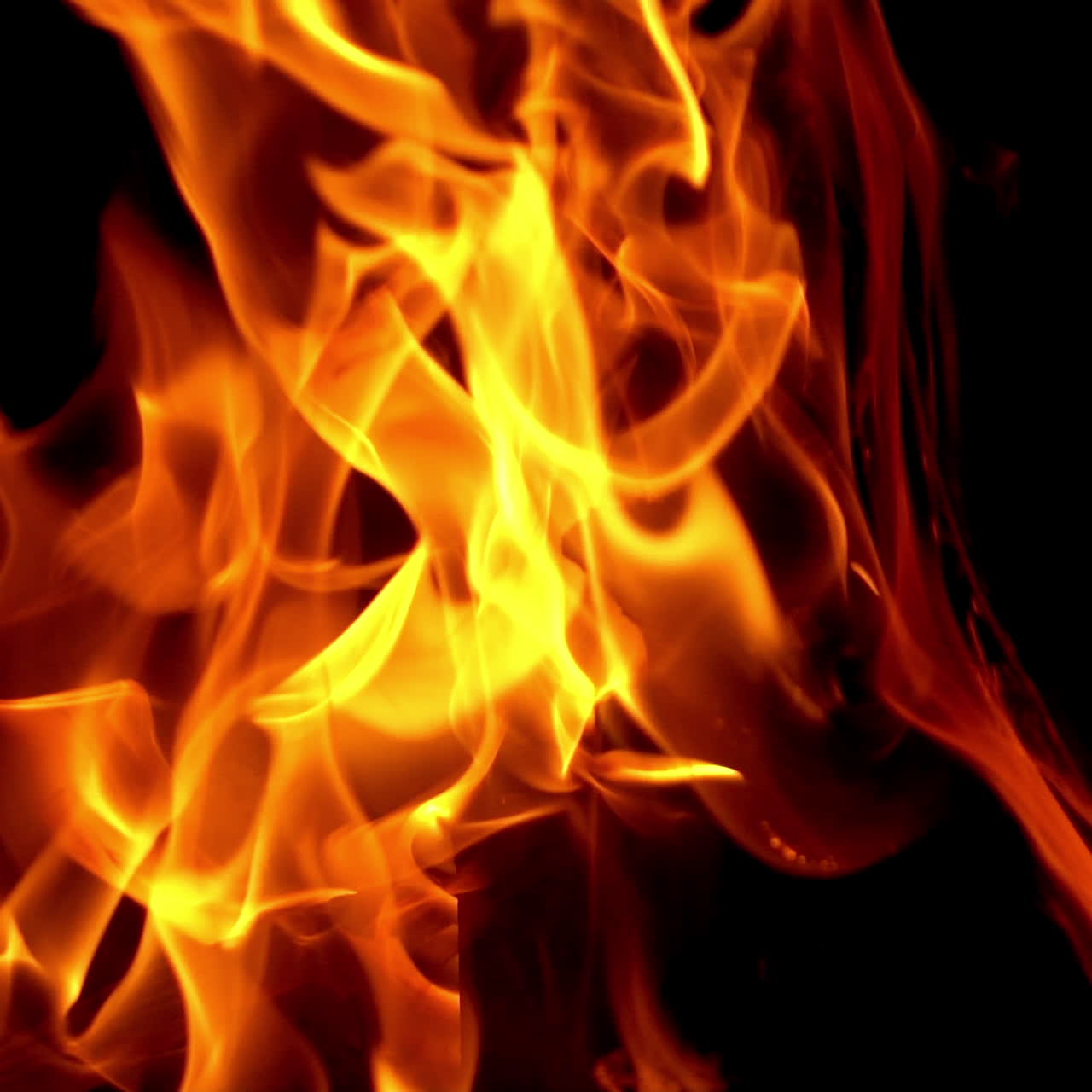 Burning fire in a home fireplace. Flame heats the rural farmhouse. Slow motion