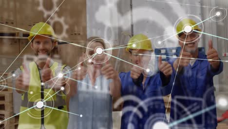 Animation-of-digital-icons-and-network-of-connections-over-workers-with-thumbs-up-in-warehouse