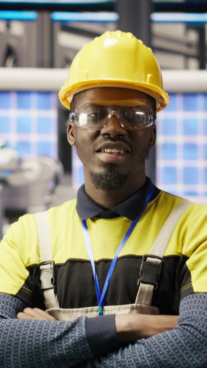 Vertical video Portrait of technician overseeing solar panel production lines equipment
