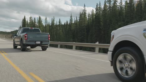 close up shot of two trucks following each other