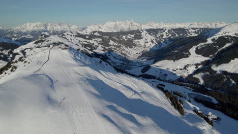 a view of tourist skiing at saalbach-hinterglemm resort town - zwölfer nordbahn cable car view