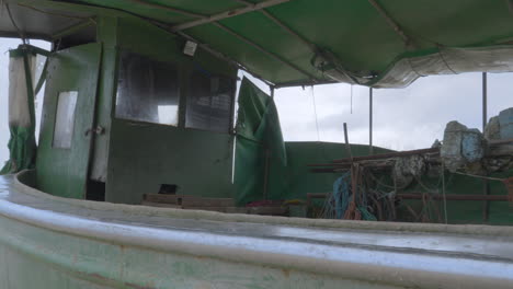 An-old-fishing-boat-moored-on-the-seashore