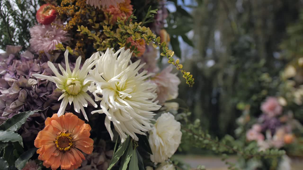 boho chic rustic wedding decoration with flowers, dolly slow motion closeup