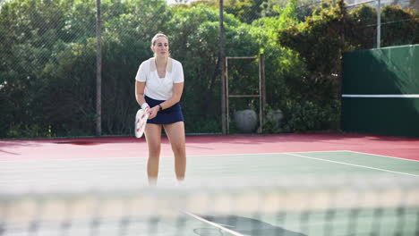 woman playing tennis on court