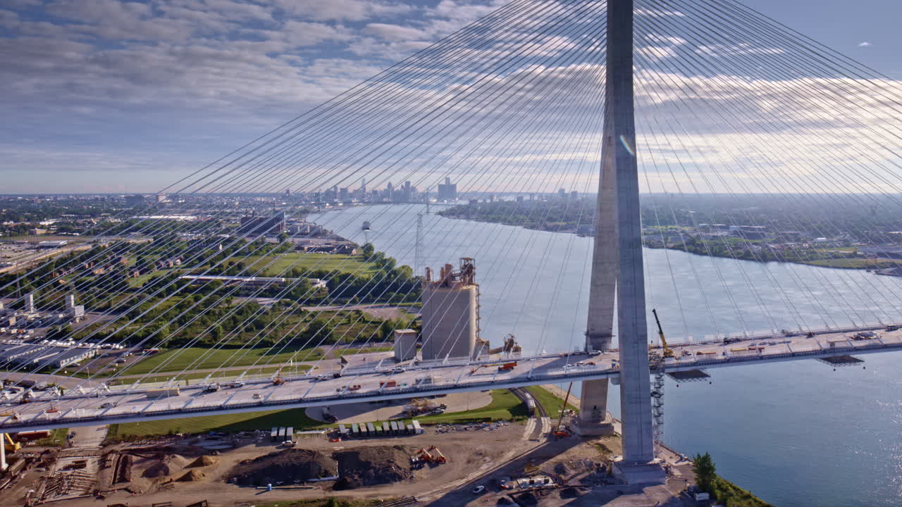 Drone shot in cinematic motion circling the bridge across the U.S.–Canada border