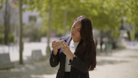 beautiful asian girl photographing with smartphone