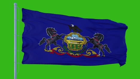 la bandera del estado de pensilvania ondeando en el viento contra el fondo de la pantalla verde