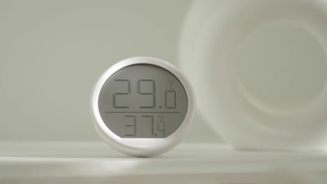 a digital thermometer and hygrometer displaying indoor temperature and humidity