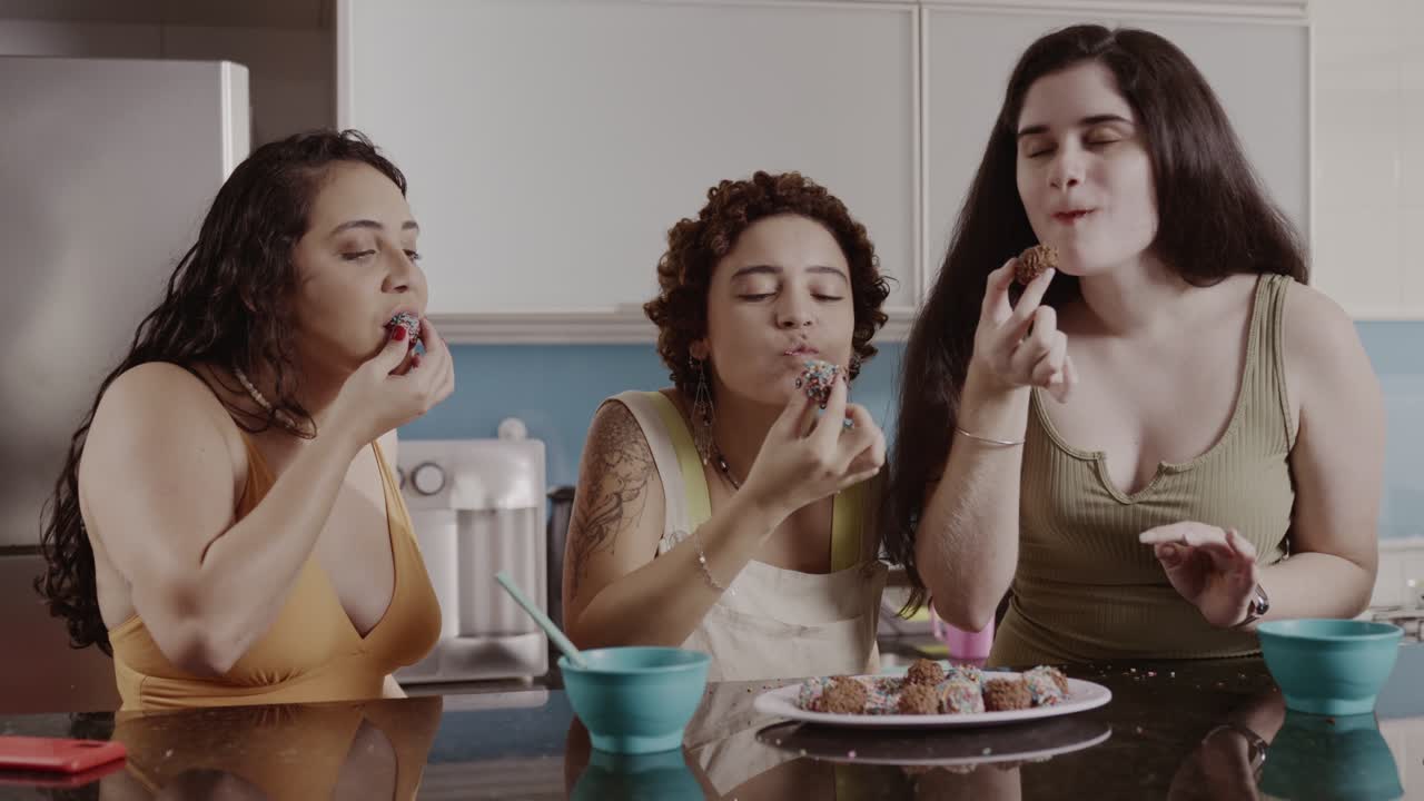 Three Women Enjoying Treats Together