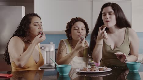 three women enjoying treats together