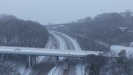 aerial footage following a semi-truck on the highway heading towards chattanooga, tn in the snow.