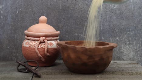 pouring long grain rice in a container