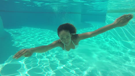 woman swimming underwater