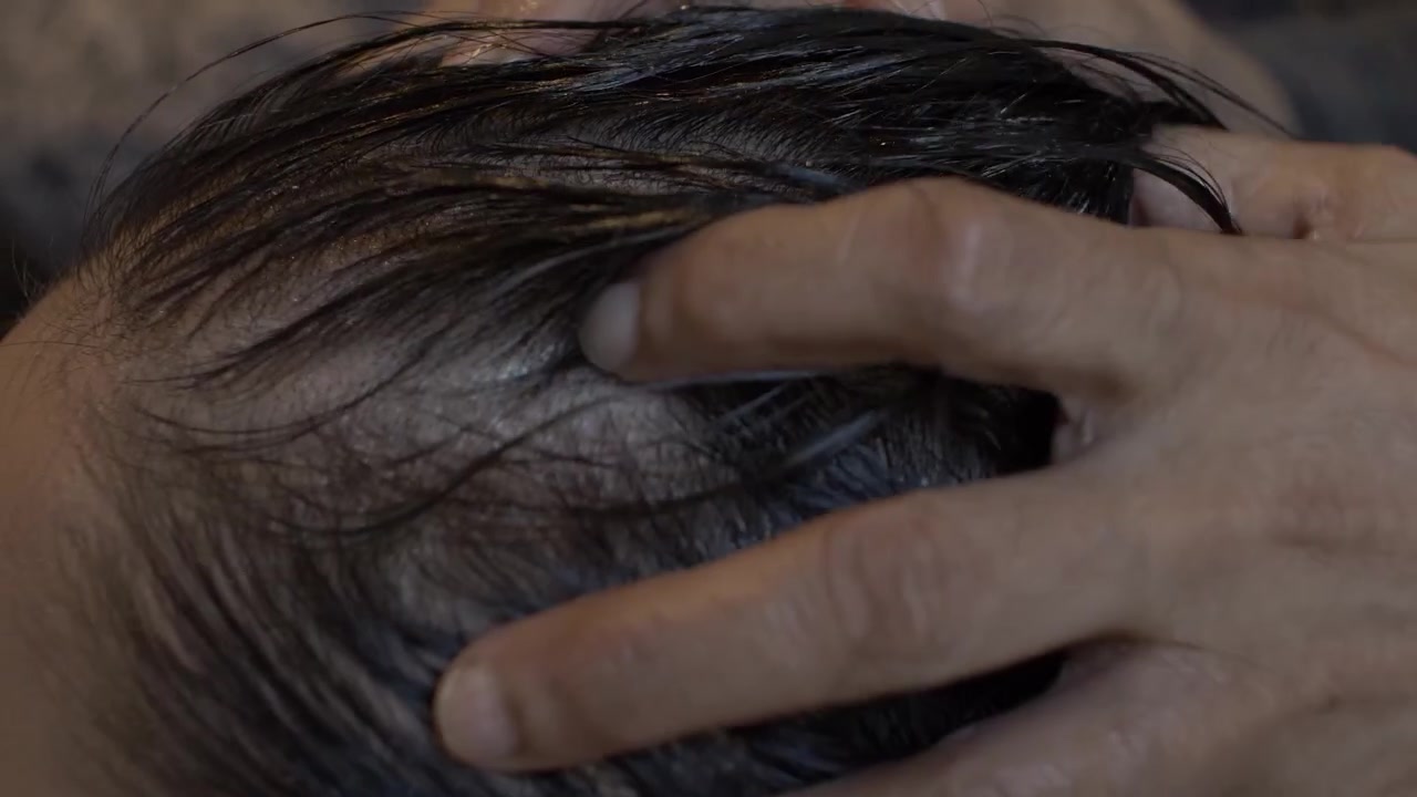 Young Asian Female Getting Oil Massaged Into Her Scalp And Hair. Locked Off, Side View , Close Up