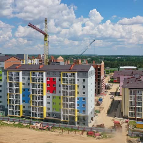 new high rise building with colorful exterior. construction site with modern apartments in the city. building of a new urban district