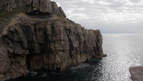 la piedra blanca at dichoso peninsula, suances, cantabria, spain, rocky cliffs by the sea