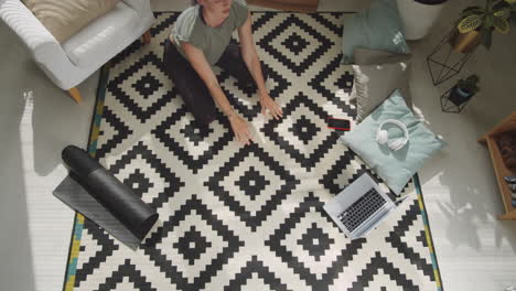 top down of woman doing yoga at home