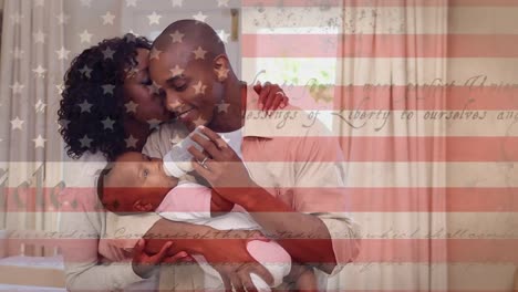 animation of u.s. constitution floating with u.s. flag over mixed race couple feeding a baby